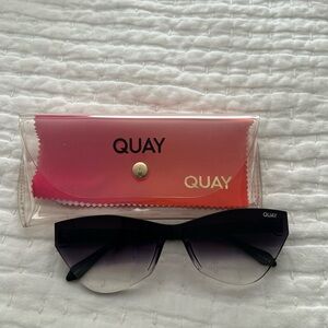 Quay Sunglasses Catwalk 1212 Modern Cat eye shape, black frame, gradient lens.